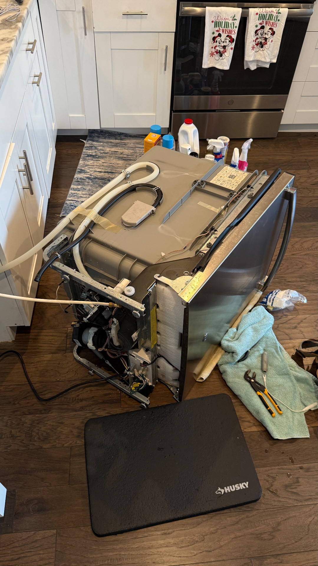 A dishwasher positioned for component access