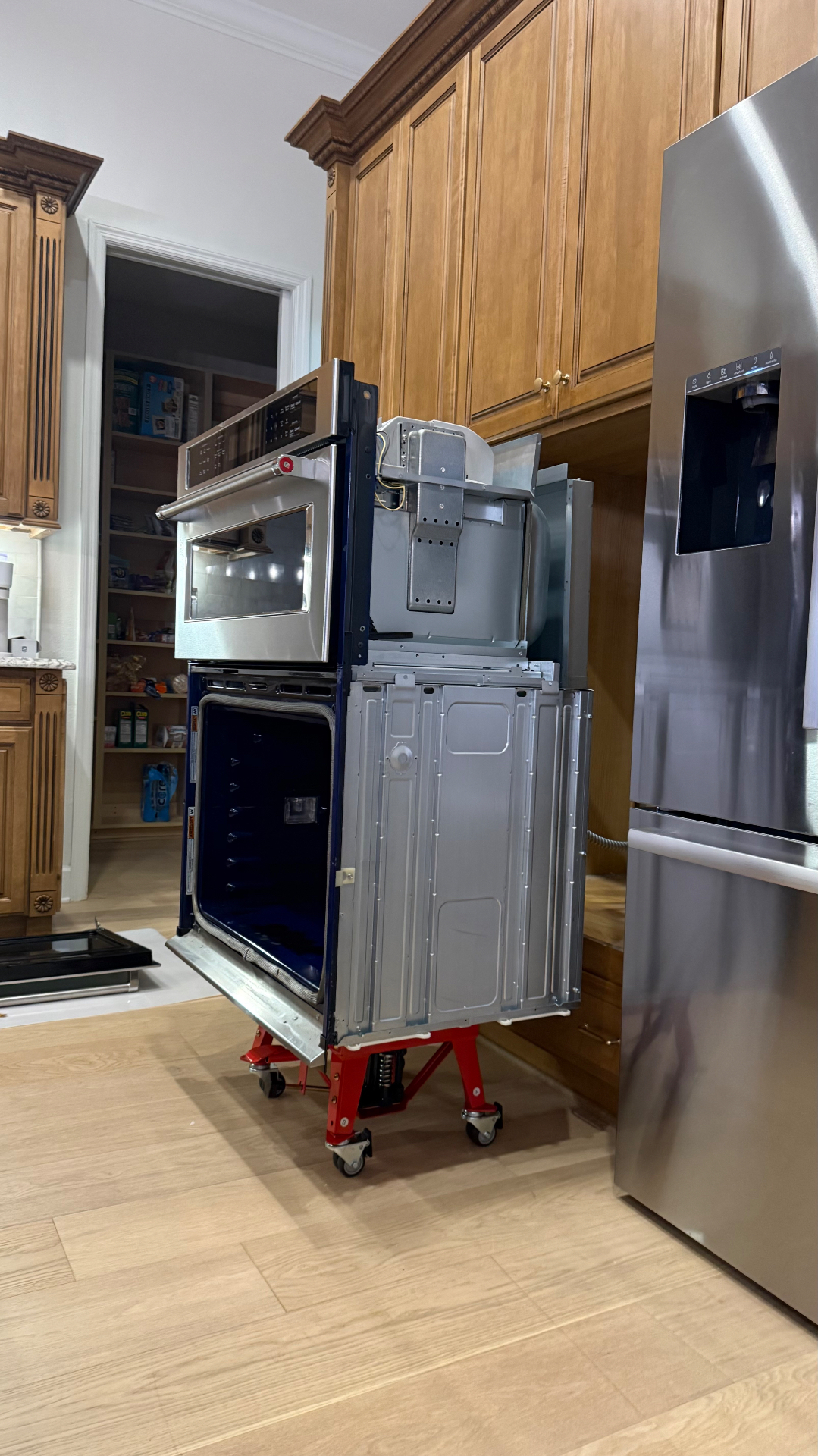 An oven supported on a moving dolly