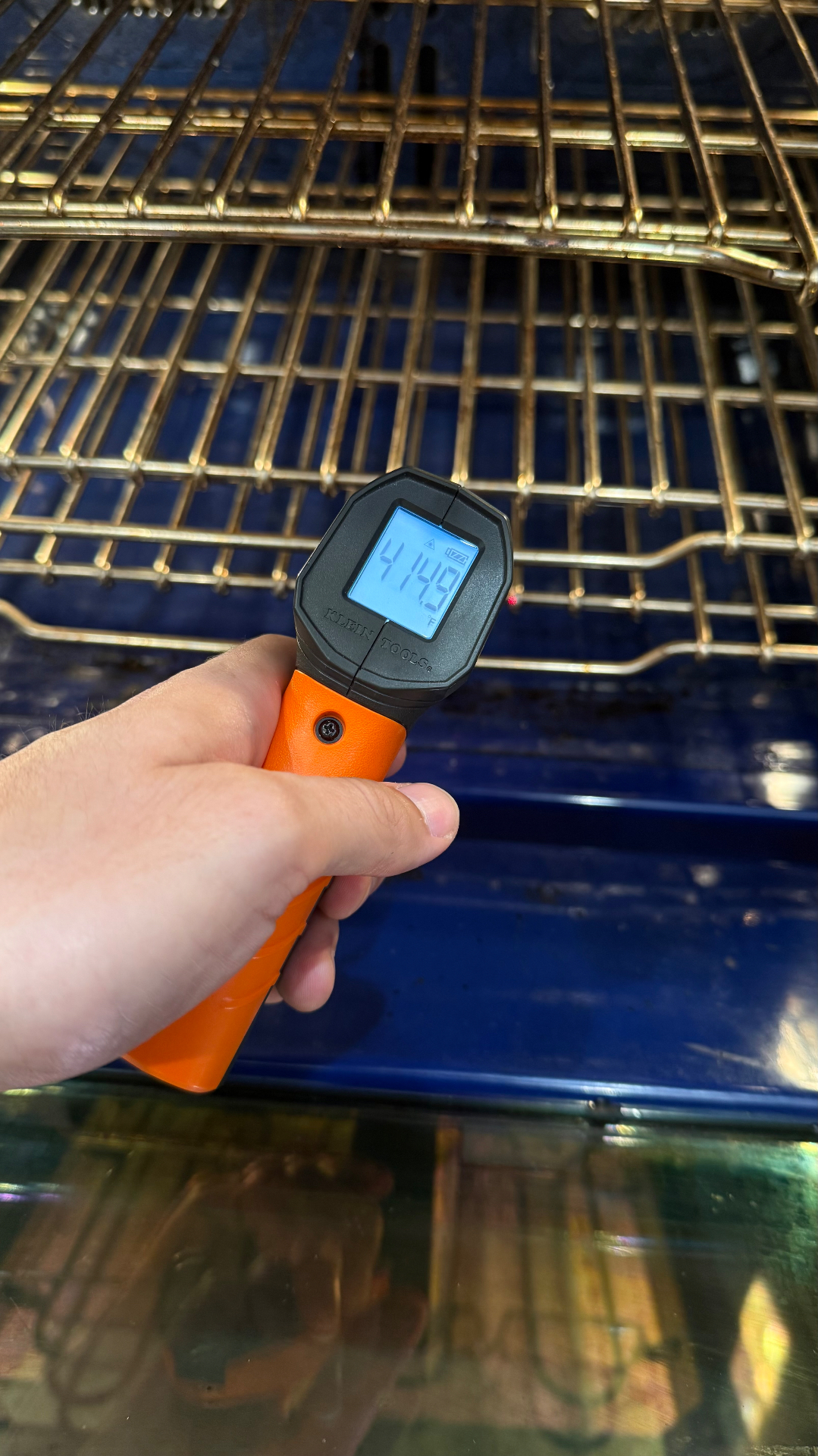 Checking an equipment temperature with a handheld meter
