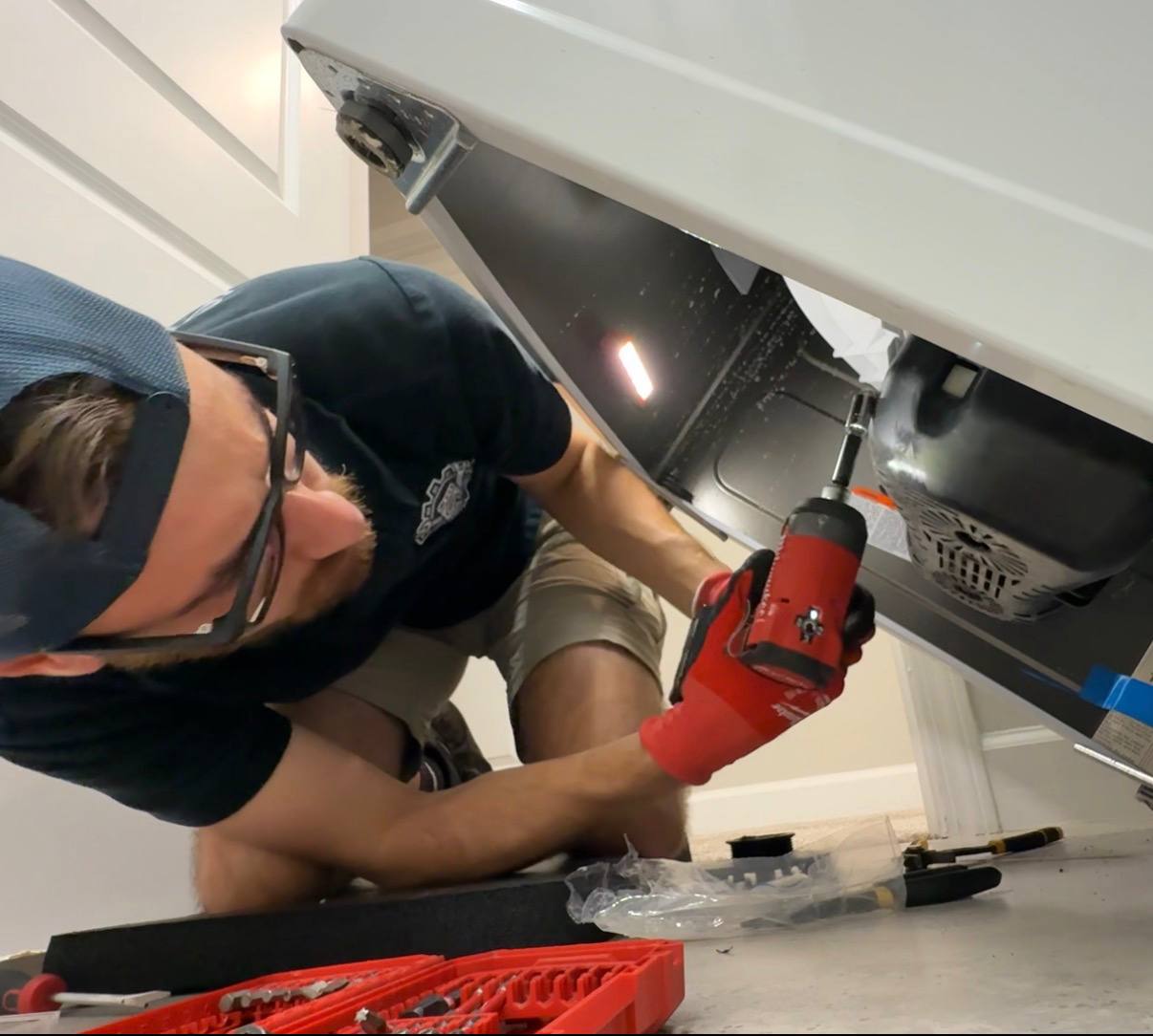 Working underneath household equipment