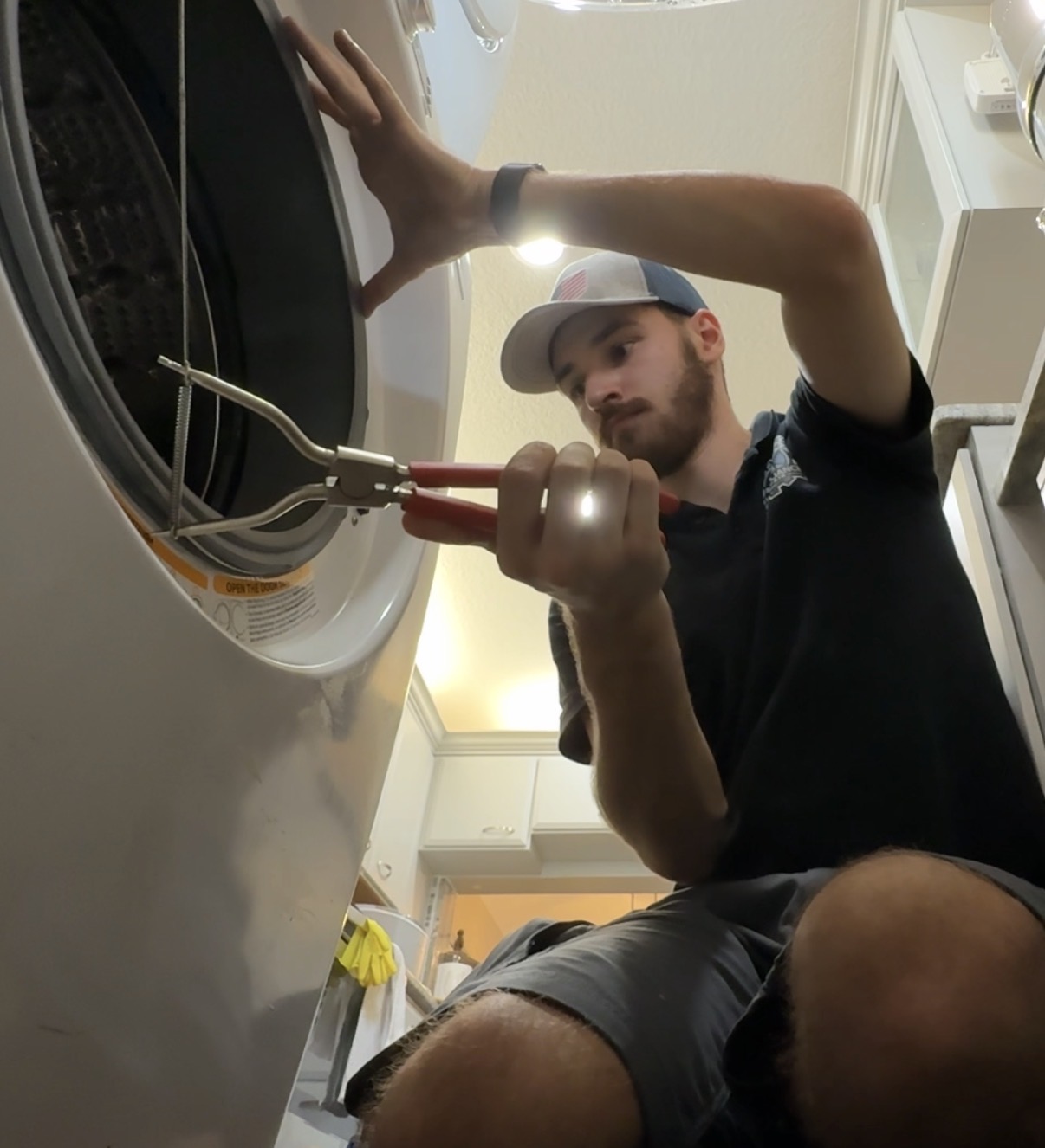 Pliers used near a washer door gasket